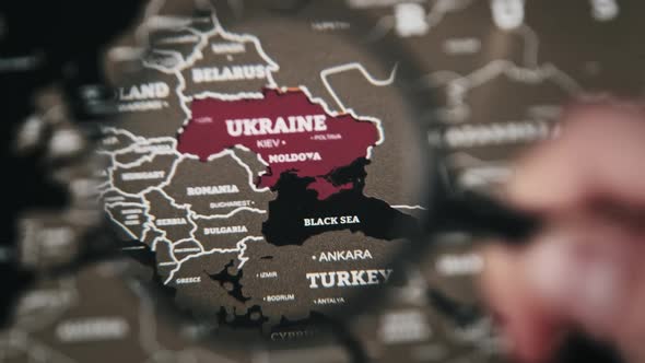 Ukraine on the World Map Under Magnifying Glass