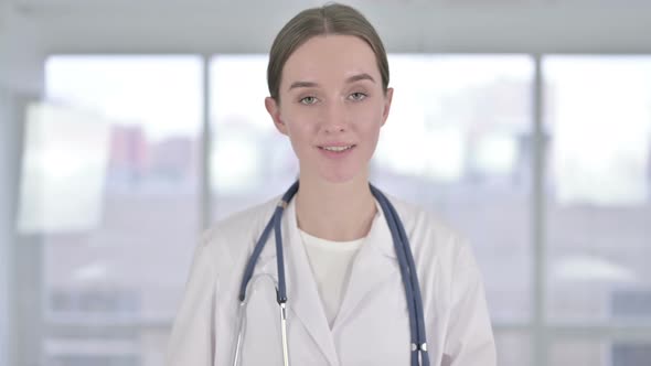 Portrait of Beautiful Young Female Doctor Doing Video Chat