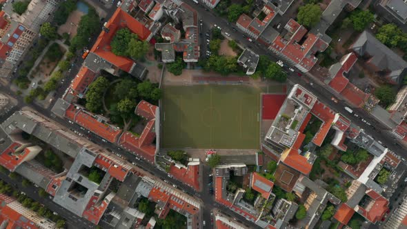 Aerial Birds Eye Overhead Top Down View of Urban Neighbourhood with Football Playground