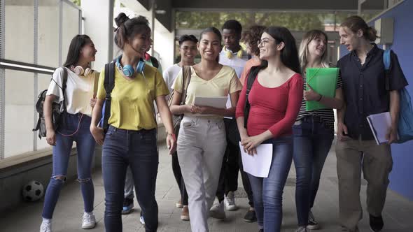 Multiethnic Group of Confident and Happy Secondary School Students Going Back to Classes