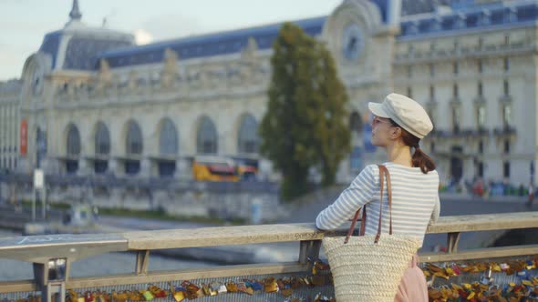 Attractive young girl on a bridge, Paris