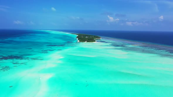 Aerial above travel of exotic coast beach lifestyle by transparent lagoon and white sand background 