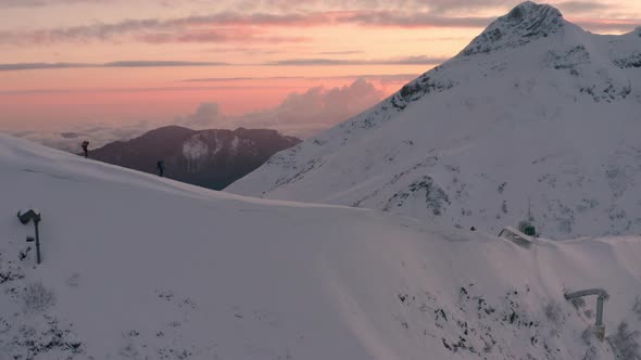 Sportsmen Ski Along Ancient Aibga Ridge with High Peaks