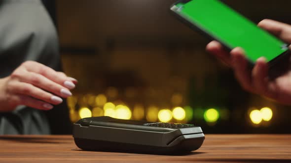 Paying By Smartphone with Chroma Green Screen Closeup