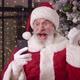 Cheerful Santa Rejoices Reading Message on His Smartphone Smiles Toothy Smile Laughs Shows Thumb Up - VideoHive Item for Sale