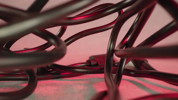 Tangled Black Wires at Red Artificial Light of Studio Room