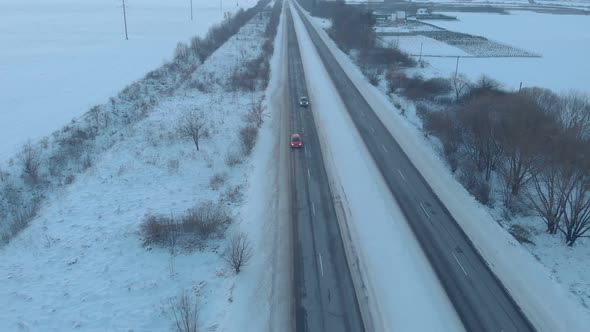 Red Car On Snow Road