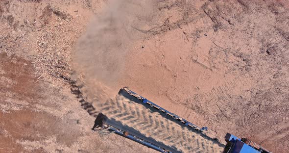 An Industrial Wood Chipper at Work with Roots for Grinding Machine to Become Chip