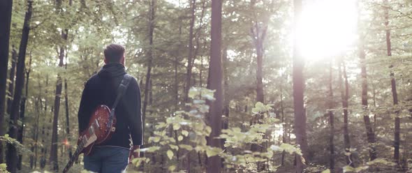 Guitar Player in the Woods