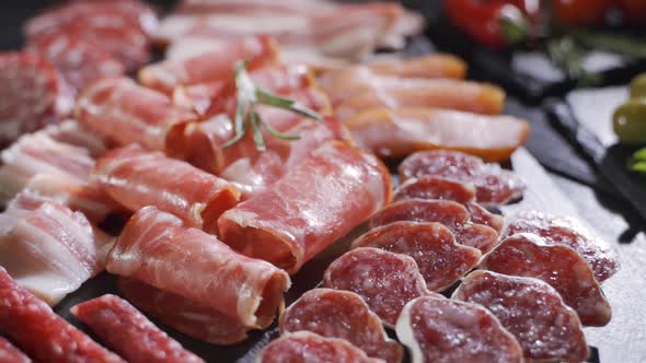 Beautifully Decorated Plates of Different Types Meat. Decorated with Condiments and Vegetables