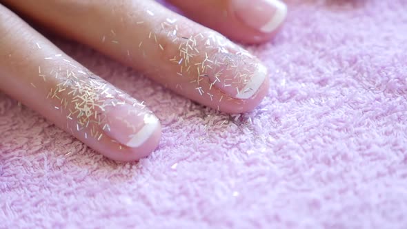 Close-up slow motion tilting on woman nails manicured in French style 1920X1080 FullHD video - Slow- alt