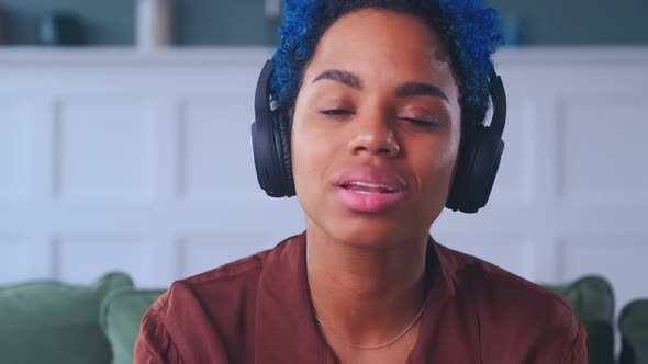 Young Friendly African American Woman Wearing Headphones Camera View