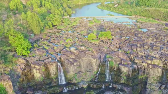 Drone Moves From River Wide Rapids To Waterfall Cascade