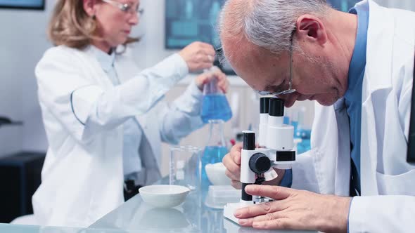 Close Up Shot of Scientist Working in Busy Laboratory