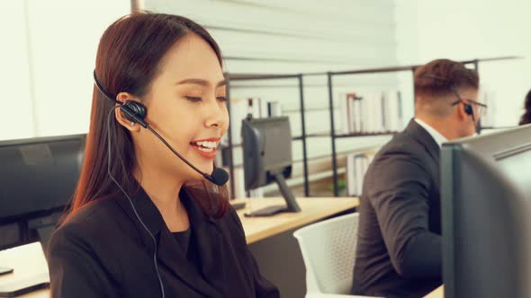 Business People Wearing Headset Working in Office