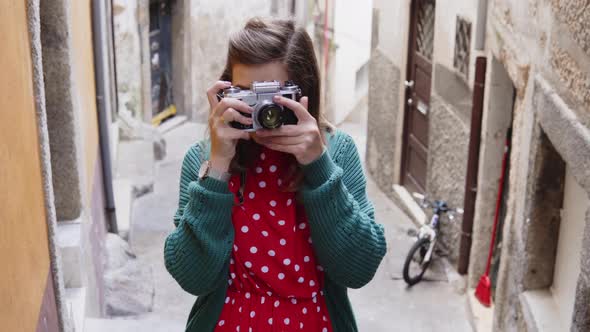 Pretty Woman Tourist Is Taking Photo on Vintage Camera