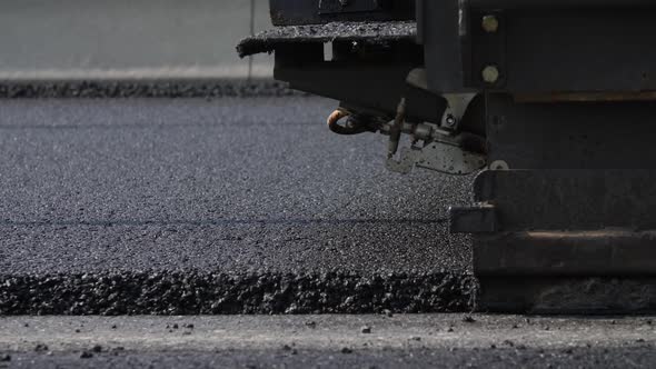 Asphalt Paver in the Process of Laying New Asphalt