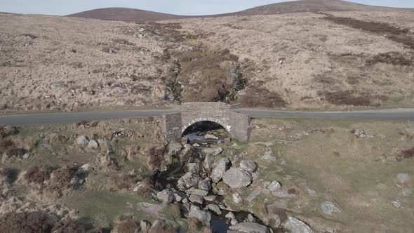 Arch Stone Bridge Over Rocky Stream At Wicklow Mountains In Dublin, Ireland. - aerial approach