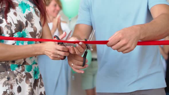 Married Couple Opens Own Business Cutting Red Ribbon in Honor Opening New Store