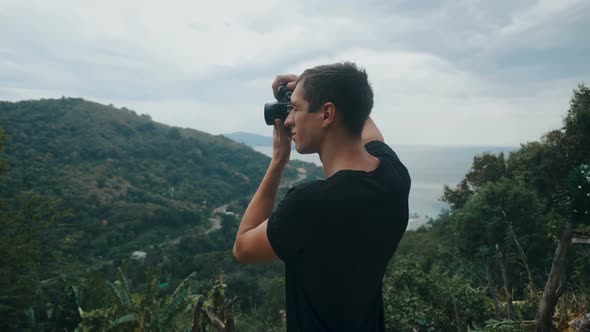 Traveler Photographing in Mountain Shooting Picturesque Views