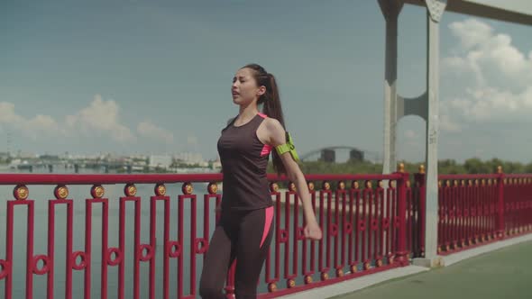 Sporty Fit Woman Warming Up During Walk Outdoors