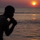 Young boxer trains on the beach of sea over sunset slow motion - VideoHive Item for Sale