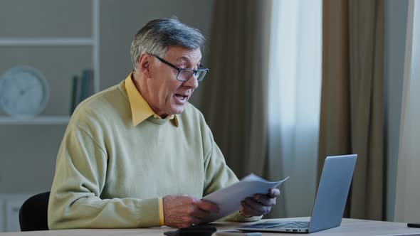 Closeup Elderly Man Negotiating Online Use Laptop Professor Teaching Lecture on Internet Sitting