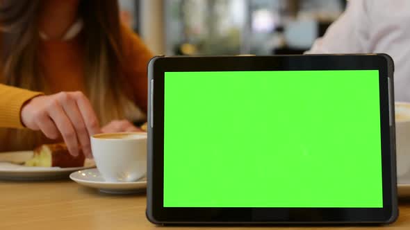Tablet Green Screen - Couple Eat and Drink in Cafe in Background