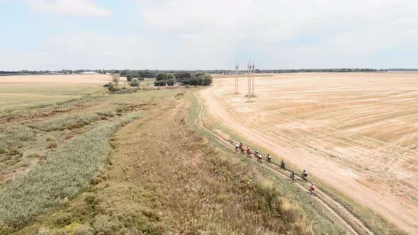 Cyclists cycling on gravel road