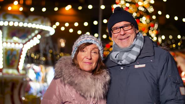 Happy Senior Couple Smiling at Christmas Market 14