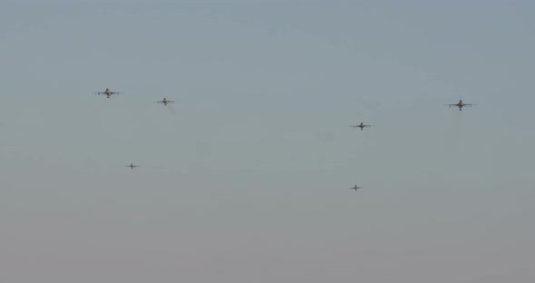 F-16 fighter planes flying at high speed during an airshow