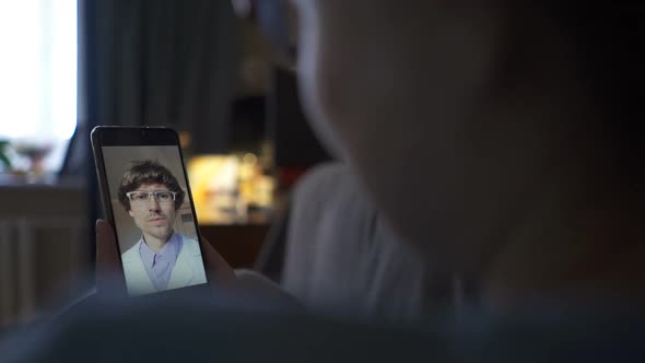 Caucasian Woman Engaged in a Video Conference with Her Doctor