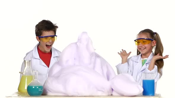 Two Cute Chemist Children Making Interesting and Successful Experiments with Foam Isolated on White