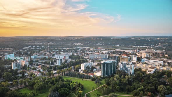 Aerial drone view of Chisinau city with park on foreground. Busy hour traffic. Moldova