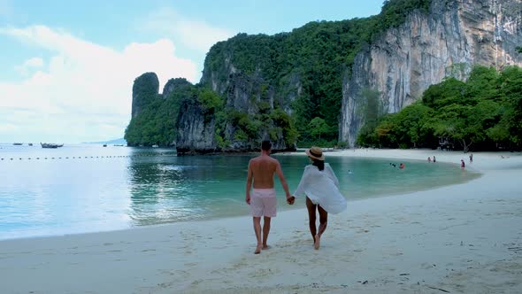 Couple Men and Woman on the Beach of Koh Hong Island Krabi Thailand Asian Woman and European Men on