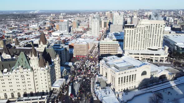 AERIAL - People gather and protest in city streets