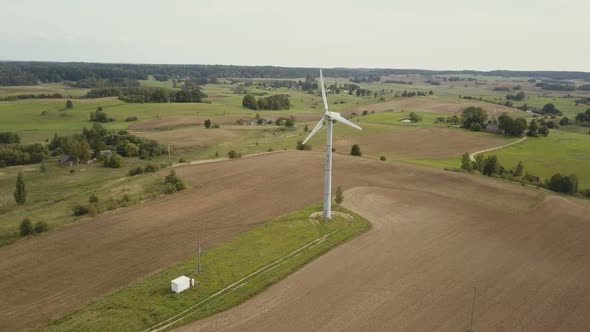 Aerial View of Single Wind Turbine Rotating Fast