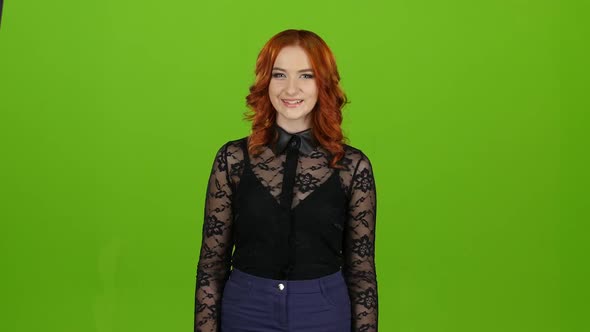 Girl Is an Hourhand, Showing a Thumbs Up and Smiling. Green Screen