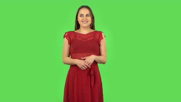 Tender Girl in Red Dress in Anticipation of Worries, Then Smiling and Proud of Himself. Green Screen