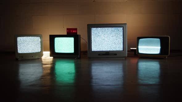 Retro Old Televisions in Darkness