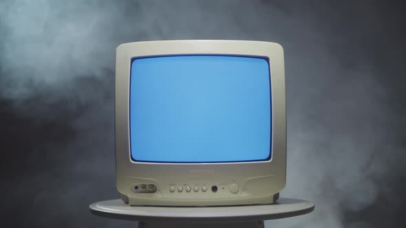 Old Vintage Television on Black Background with Smoke