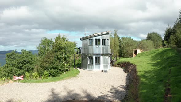 AERIAL REVEAL - Rising shot revealing the Sound of Mull behind the modern home