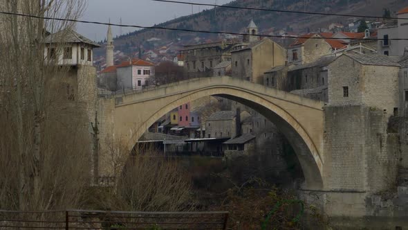 A view of the Old Bridge in Mostar Bosnia and Herzegovina with Old Town at the background