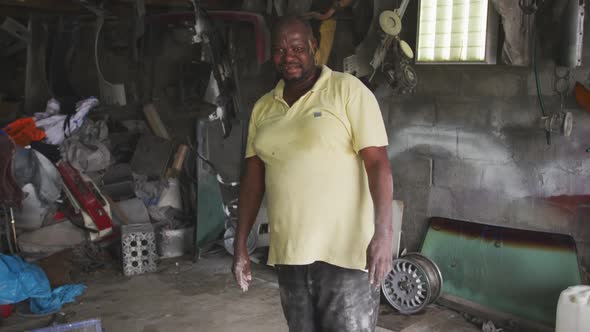 African handyman smiling at camera