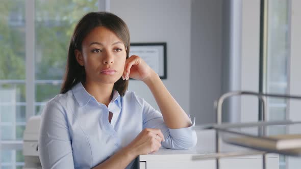 Portrait of Pensive African Businesswoman Looking Out of Window in Modern Office