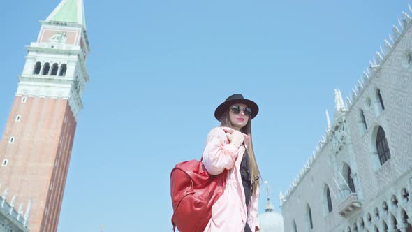 Young Woman Tourist Walks on St