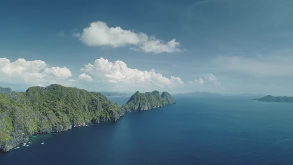 Hilly Islands at Blue Ocean Coast Aerial View