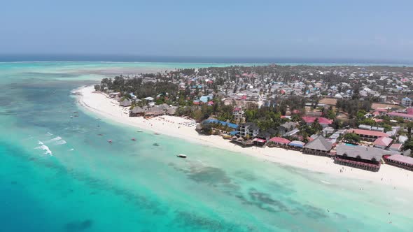 Aerial Coastline of Paradise Beach and Clear Water Over Reef in Ocean Zanzibar