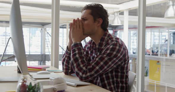 Young man working in a creative office