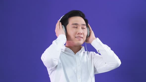 Japanese Youngster with Headphones Isolated, Happy Expression